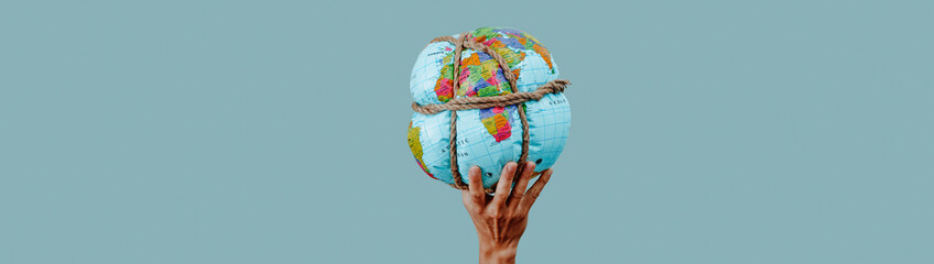 man holding a tied earth globe, web banner