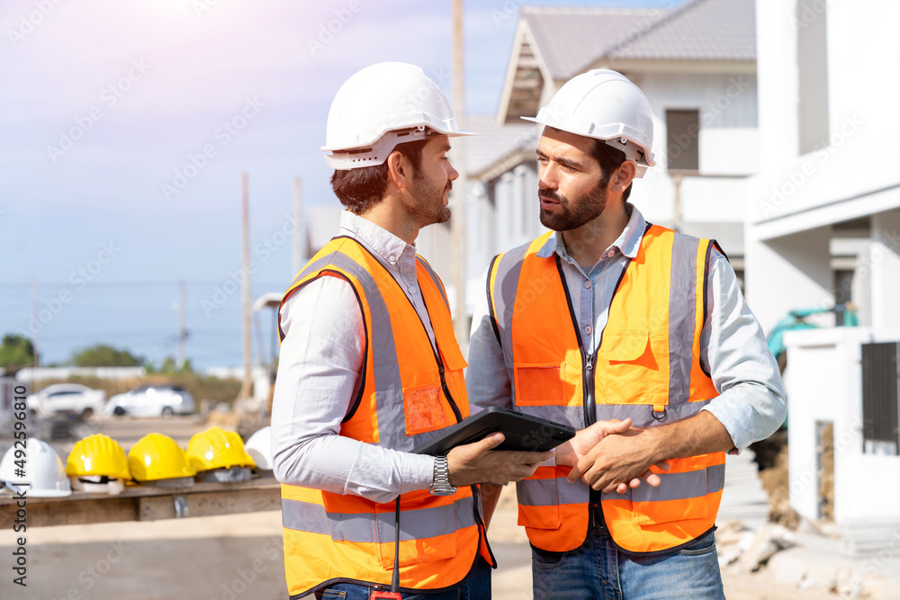 Poster architect,foreman and worker discussing in building construction site in construction site,construct