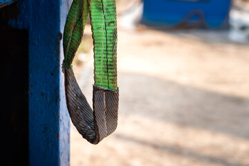 Close-up at webbing lifting sling hook which is using for lift the heavy object at the construction...