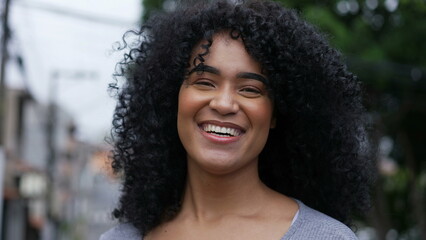 Young woman laughing and smiling happy person