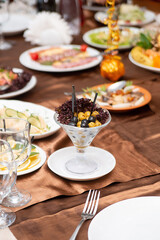 olives in a glass on the table