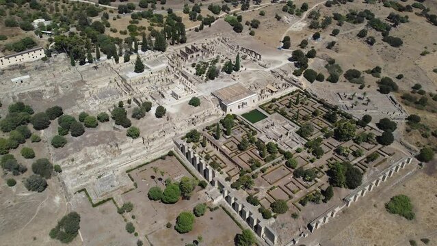 Aerial drone view of the Caliphate City of Medina Azahara in Cordoba . Archaeological site. Unesco World Heritage, Spain. Ancient civilization. Historic place. Touristic destination for holidays. 
