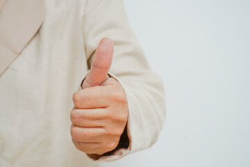 Close-up showing thumb-up expressing positive estimation.Approval concept