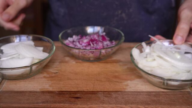 Person showing different types of onion cuts, slices, dice, brunoise