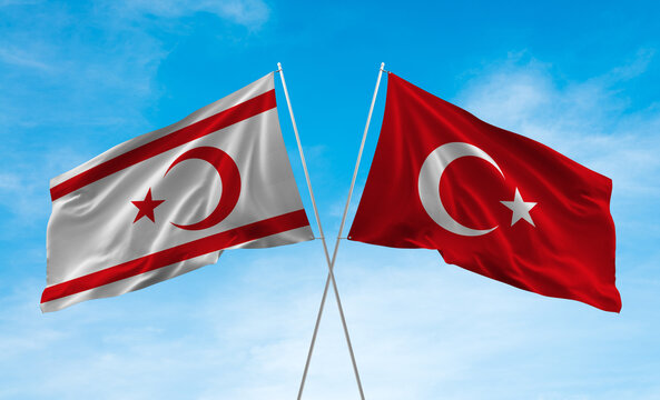 Northern cyprus and turkey flags waving in the blue sky
