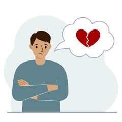 Fototapeta premium Sad man thinks about love. In a balloon of thought, a red broken heart. The concept of parting and not shared love.