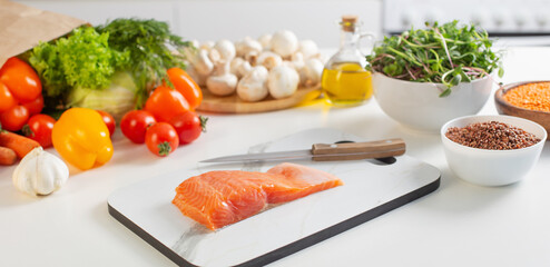 red fish and various vegetables in  kitchen