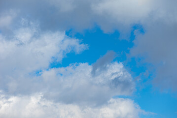 Obraz na płótnie Canvas White Clouds In The Blue Sky. Sunny Day.