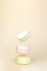 Delicious sweet puffy Colorful marshmallows flying on pastel beige background. Sweet break concept