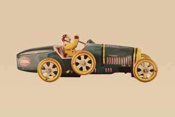 Vintage metal toy racing car with driver on a sepia background