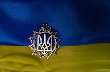 Ukrainian national emblem trident on the yellow-blue  waving flag