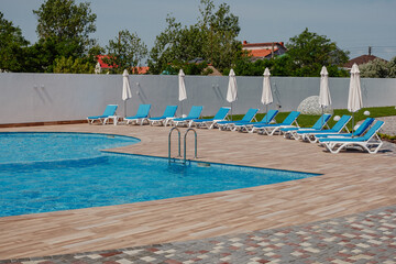 pool view with sun loungers