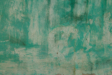 Background of an ancient wall in cyan painted color. Bright grunge vintage background texture. 