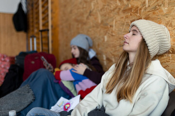 Fototapeta premium Ukrainian war refugees in temporary shelter and help center.