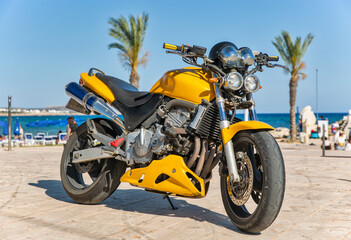Fototapeta na wymiar modern yellow sport motorbike closeup outdoors