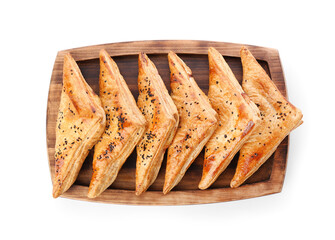 Board with tasty Uzbek samsa on white background