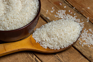 Rice in a plate on a wooden background. Traditional rice dish. dry rice