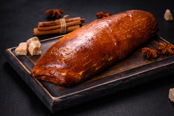 Delicious fresh roll with apricot jam on a dark concrete background