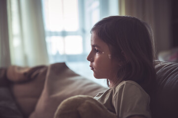 Cute little girl with chickenpox at home. Varicella zoster virus.