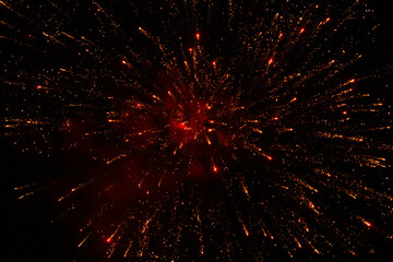 Fototapeta na wymiar Firework. Night sky. Red, orange, yellow lights.