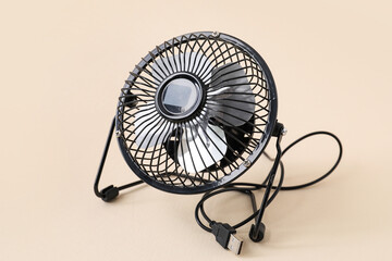 Desktop cooling fan on color background