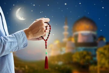 Ramadan Kareem greeting. Man praying.