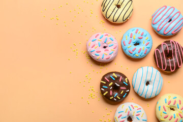 Different sweet donuts on color background