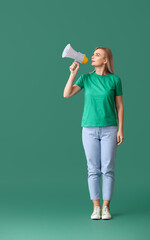 Woman with megaphone on green background