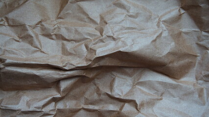 The surface is crumpled craft paper