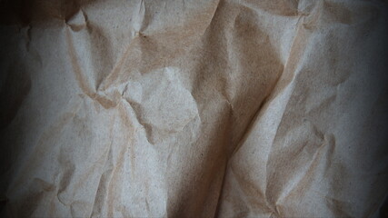 Crumpled kraft paper with a dark vignette