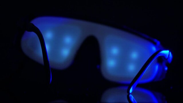 Binaural glasses with flashing light for pulsing rhythmic sound and meditation