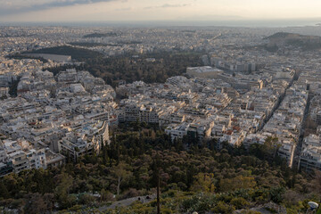 Obraz premium Athens Greek capital seen from above. Bird's eye view from Acropolis over the city with white houses, towers.