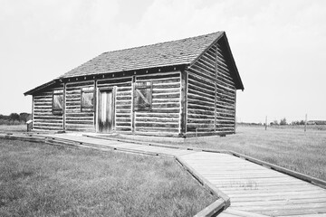 A reconstructed buildings of wood and chink of a trading post from early 1800s