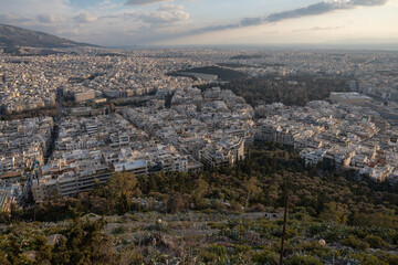 Athens Greek capital seen from above. Bird's eye view from Acropolis over the city with white houses, towers.