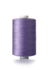 Purple sewing thread spool on white background