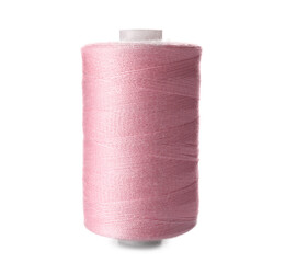Pink sewing thread spool on white background