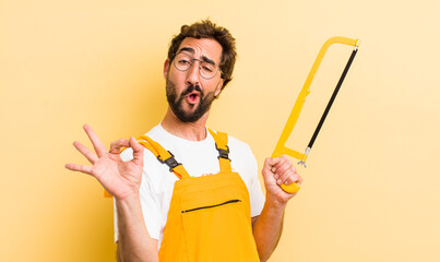 crazy handyman with a saw