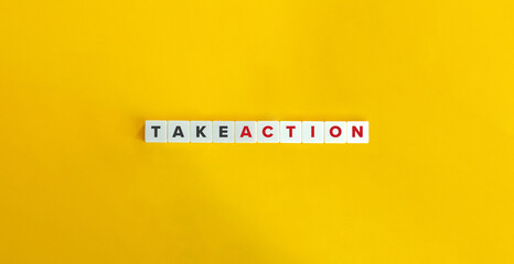 Take Action on Letter Tiles on Yellow Background. Minimal Aesthetics.