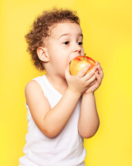 Child eating apple fruit for healthy nutrition