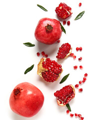 Beautiful composition with pomegranates on white background