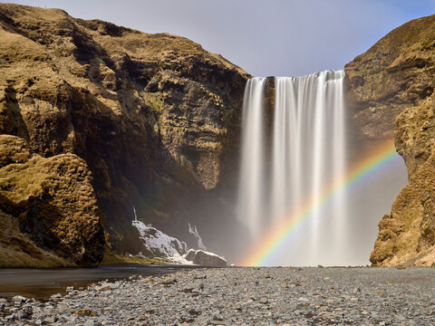 View of Skogafoss Waterfall with the rainbow in winter time, Iceland.