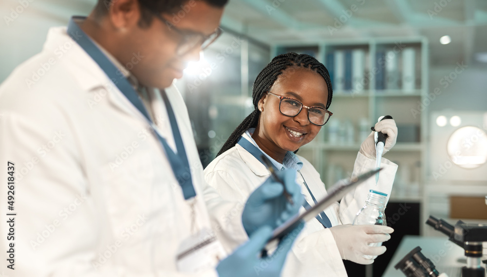Aufkleber uncovering something new. portrait of a young scientist working alongside a colleague in a lab.