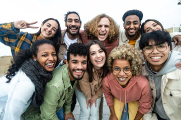 Happy group of multiethnic young friends - Diverse people smiling at camera outdoors - Community...