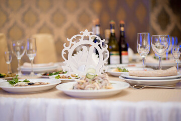 festive wedding table in the restaurant. serving food utensils