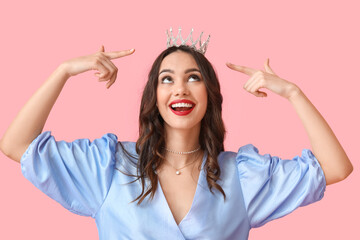 Beautiful young woman in stylish dress and tiara on pink background © Pixel-Shot