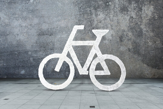 White bicycle sign, bike, cycle. Concrete wall background