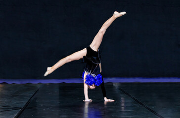 cheerleader girl standing on her hands