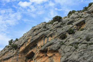 Landscape with high rocks, scarps and caves of the canyon of the Verdon Gorge in the regional national park Verdon, Provence, France
