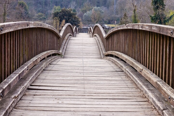 Fototapeta na wymiar Nice wooden bridge with arcs