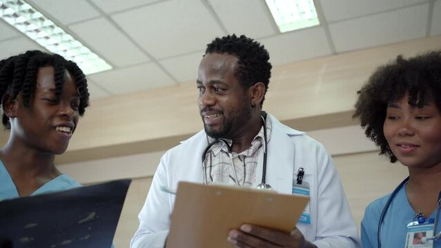 Group of American - African ethnicity medical student or intern doctor in general hospital making a discussion.